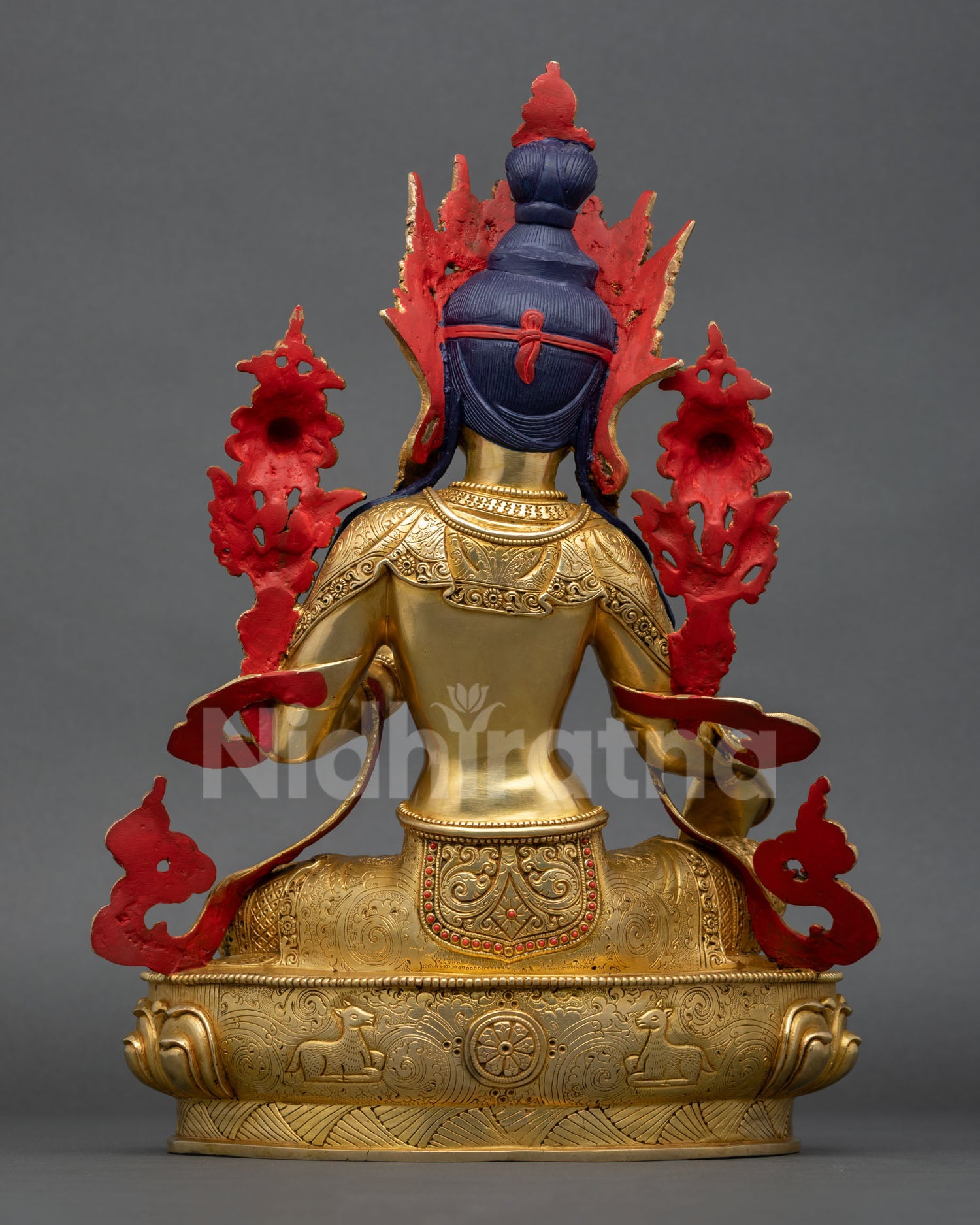 back view of green tara statue with detailed lotus throne and handcrafted nepalese artistry