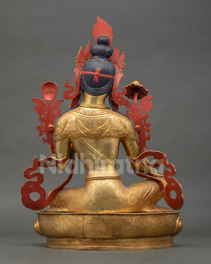 Back view of Green Tara statue with detailed robes, crown design, and gilded craftsmanship
