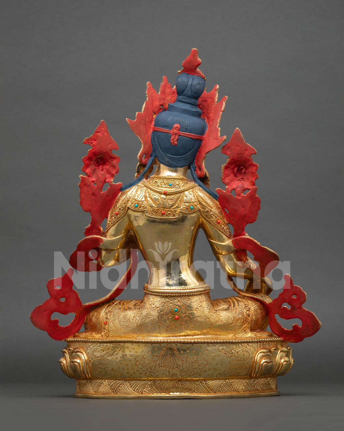Back view of Green Tara statue with engraved 24K gold fire gilding and red painted backdrop