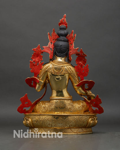 Back view of Green Tara statue with engraved lotus base and sculpted robe patterns