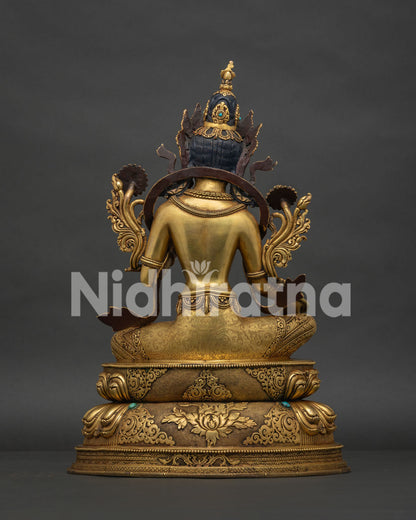 Back view of Green Tara statue with intricate copper craftsmanship and ornaments