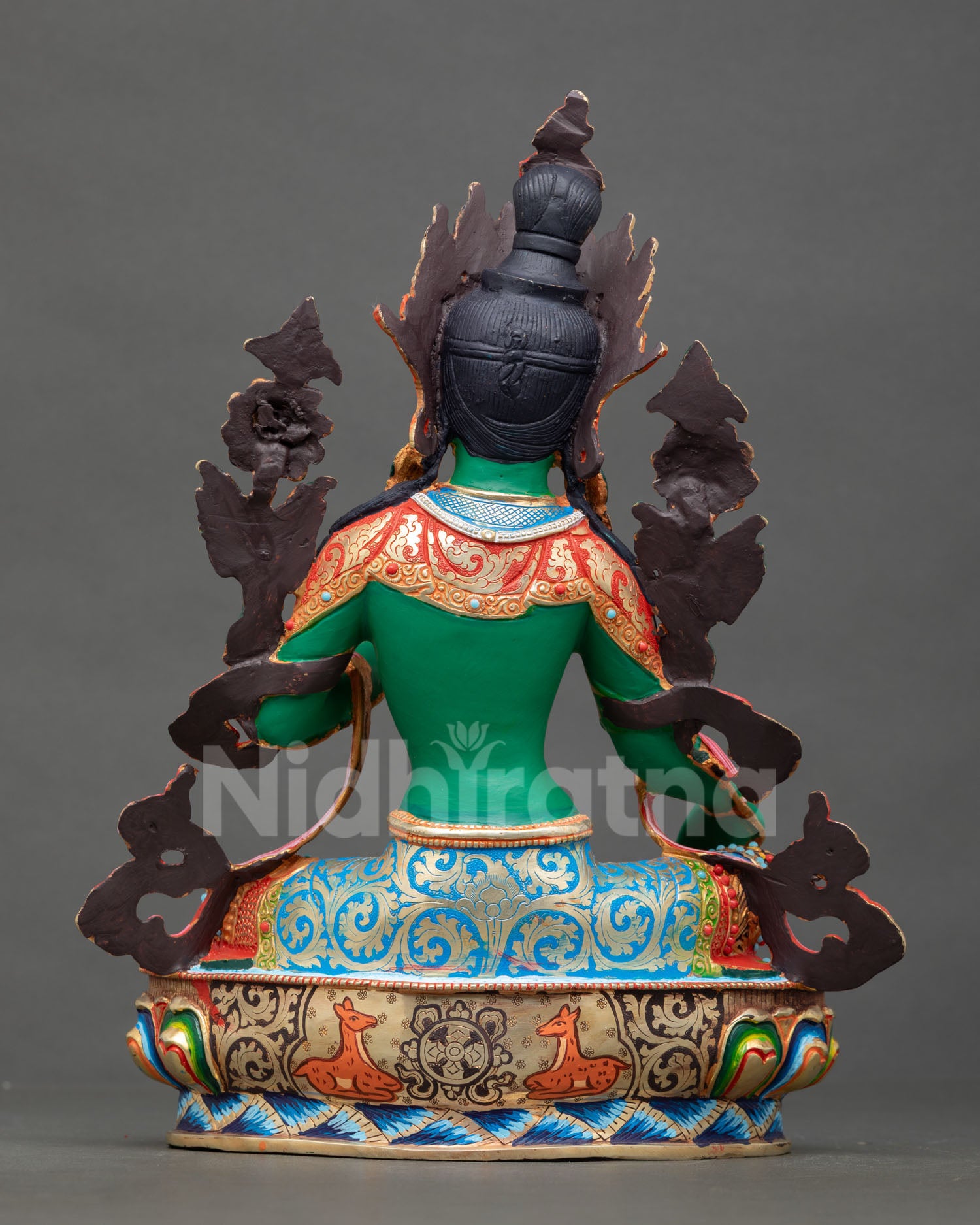 back view of green tara statue with intricate handpainted copper detailing