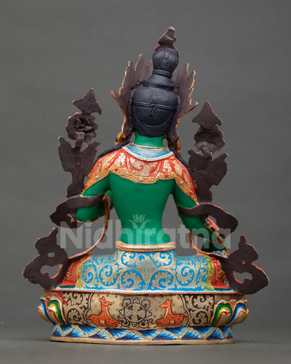 back view of green tara statue with intricate handpainted copper detailing