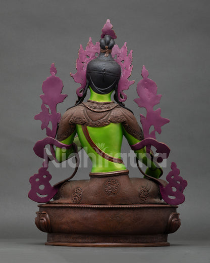 back view of green tara statue with ornate craftsmanship and lotus pedestal details