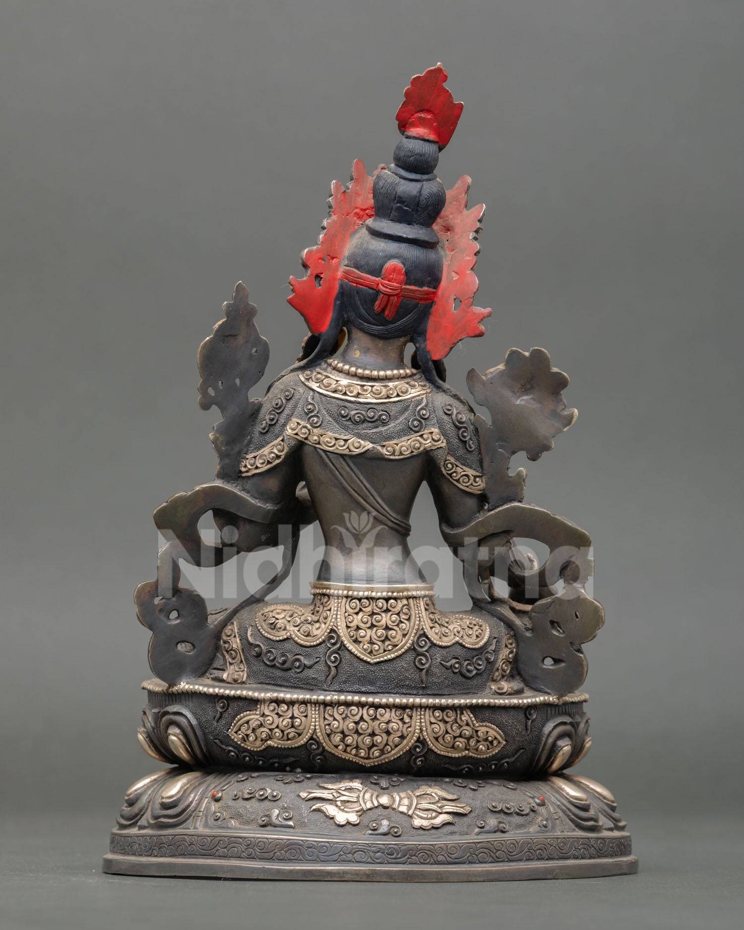 back view of green tara statue with silver-plated finish and double lotus base