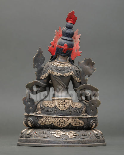 back view of green tara statue with silver-plated finish and double lotus base