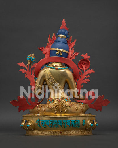 Back view of Green Tara statue's lotus seat featuring her sacred mantra inlaid in turquoise.