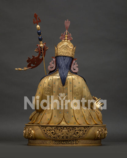 Back view of Guru Rinpoche copper statue showing kirtimukha face detail