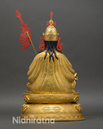 Back view of Guru Rinpoche statue highlighting handcrafted detailing in oxidized copper, made by skilled artisans of Nepal.