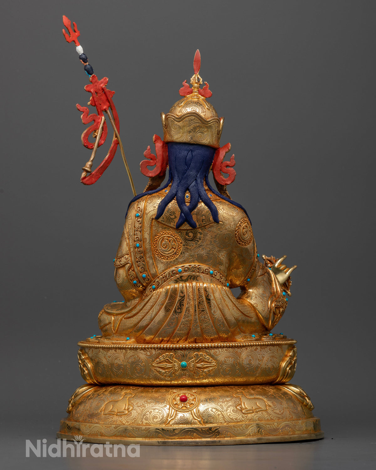 Back view of Guru Rinpoche statue showcasing intricate carvings, gold-gilded details, and traditional Nepalese craftsmanship.