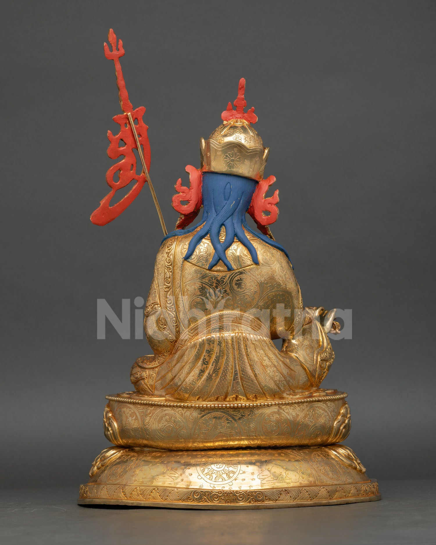 Back view of Guru Rinpoche statue showing detailed robes, khatvanga staff and artisan craftsmanship