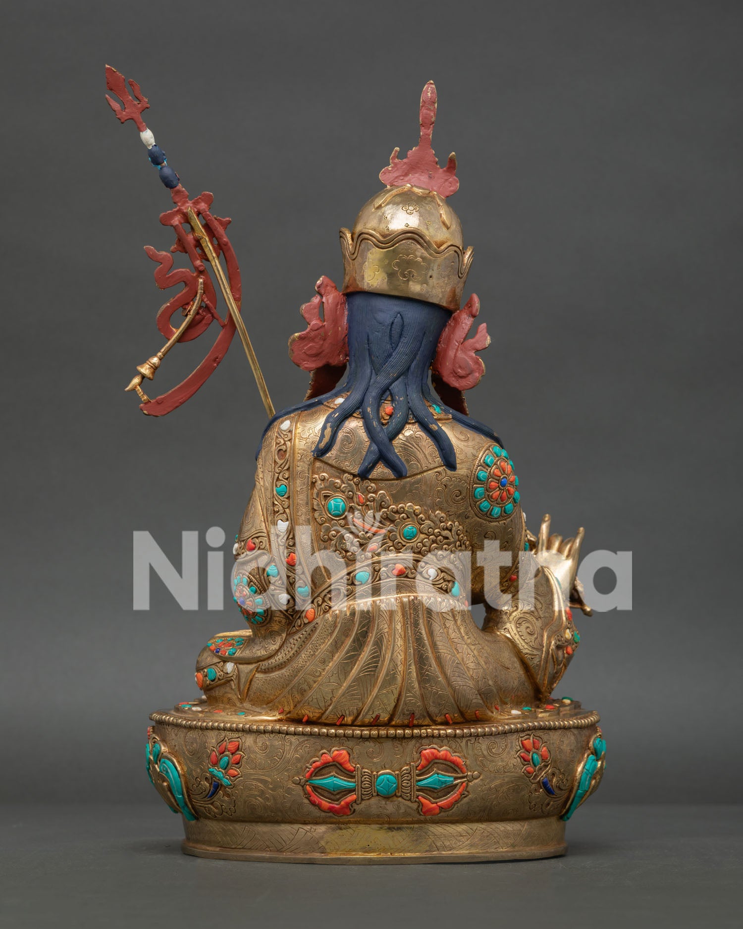 Back view of Guru Rinpoche Statue with khatvanga trident and Himalayan craftsmanship