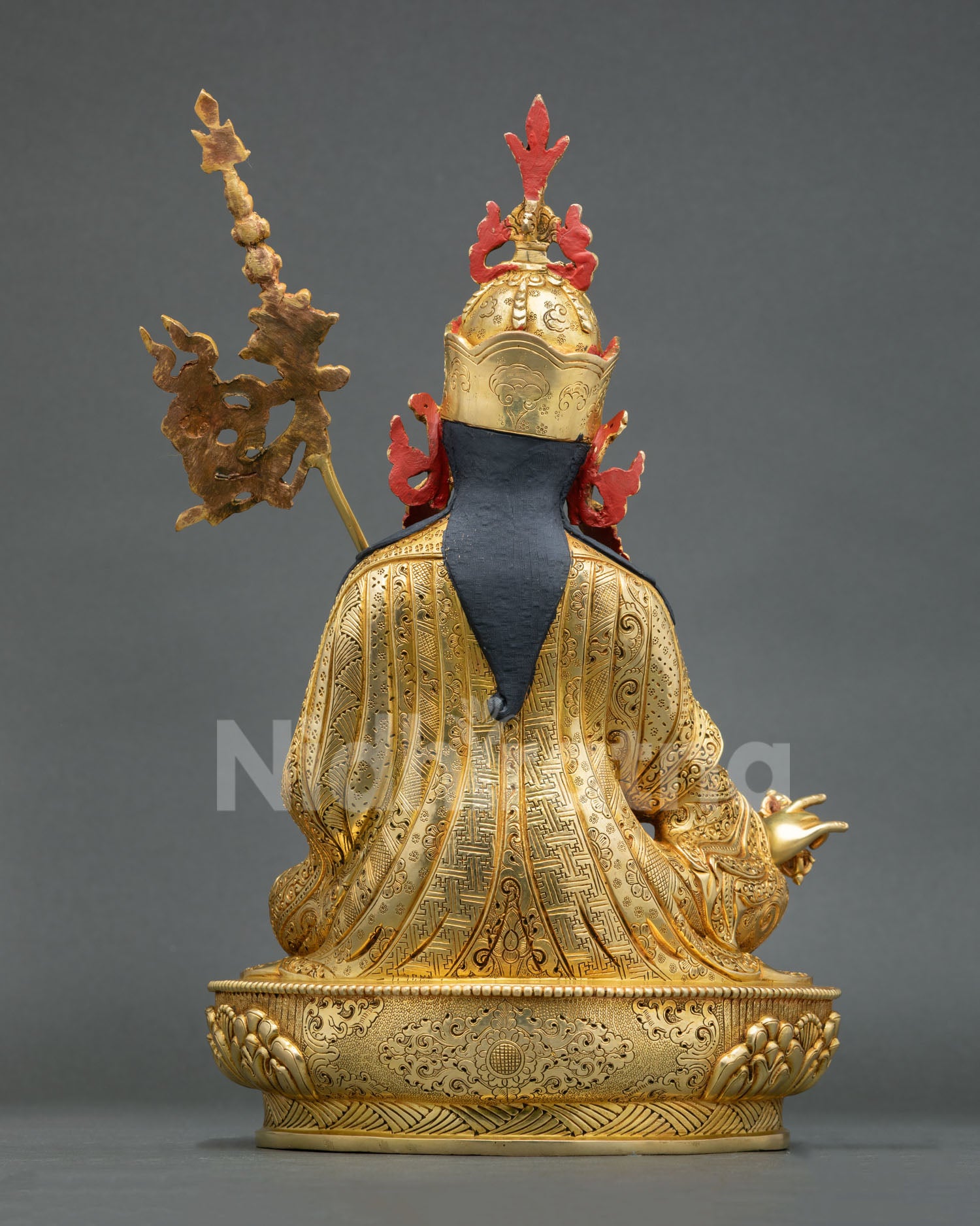 Back View of Guru Rinpoche Statue with Ornate Carvings and Traditional Patterns