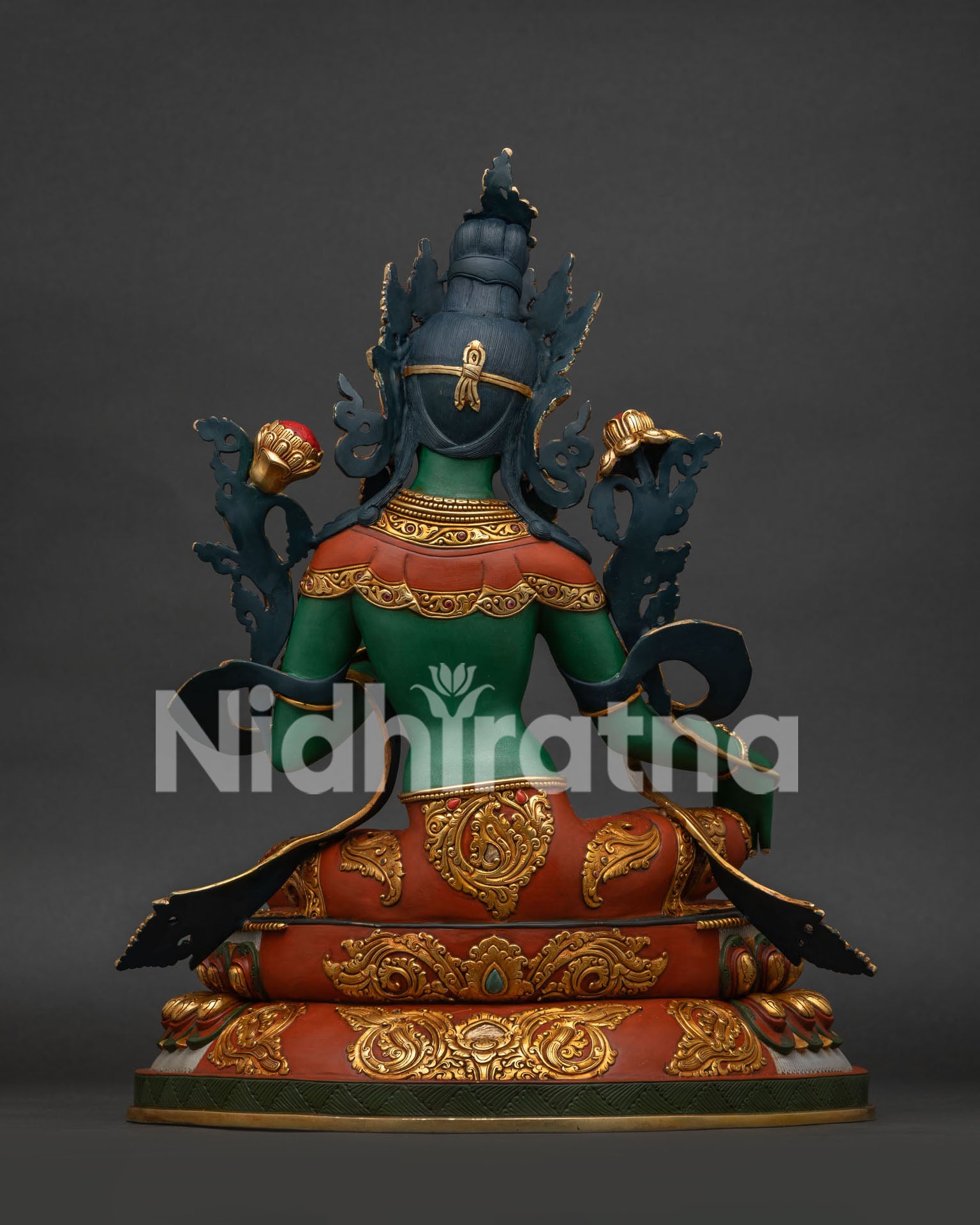 Back view of hand-carved copper Green Tara statue with gold gilding