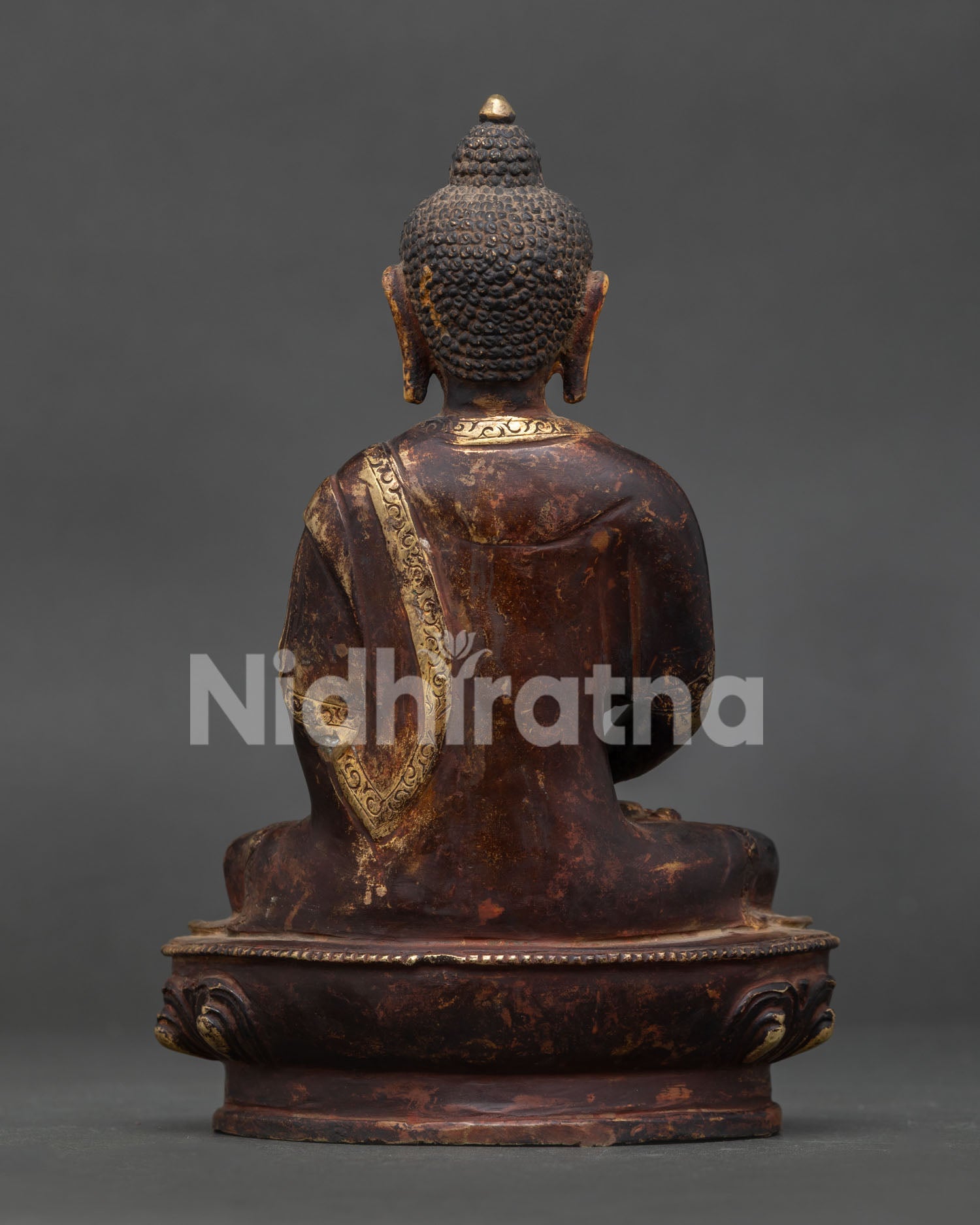 Back view of handcrafted Amitabha Buddha statue showing intricate copper carving and Newari craftsmanship.