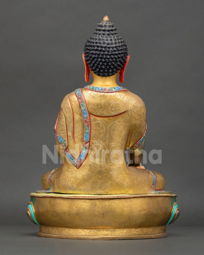 Back view of a handcrafted Buddha Shakyamuni statue showing detailed metalwork and traditional Nepalese artistry