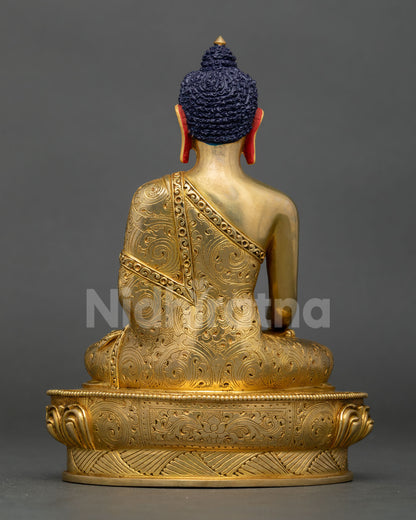 Back view of handcrafted Buddha Shakyamuni statue with intricate Nepalese craftsmanship and lotus pedestal