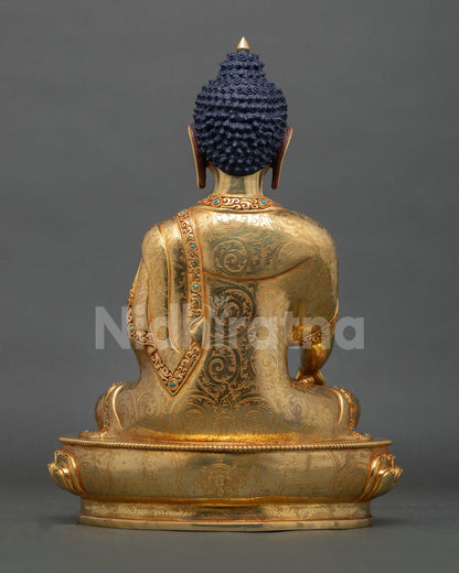 Back view of handcrafted Buddha statue from Nepal showcasing copper detailing gold accents and traditional Newari artisan workmanship