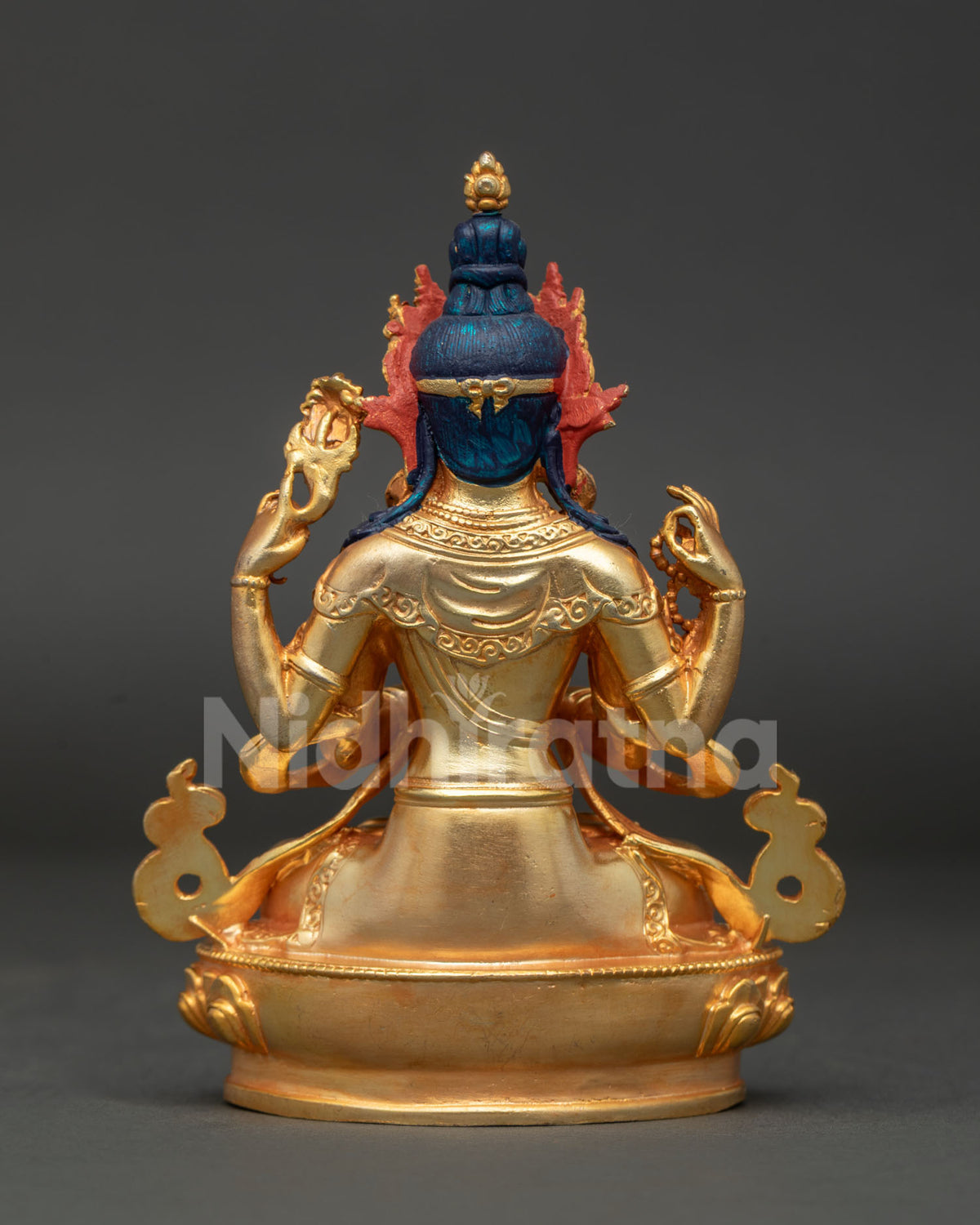 Back view of handcrafted Chenrezig Buddhist statue showing refined Newari craftsmanship and gold gilded details.