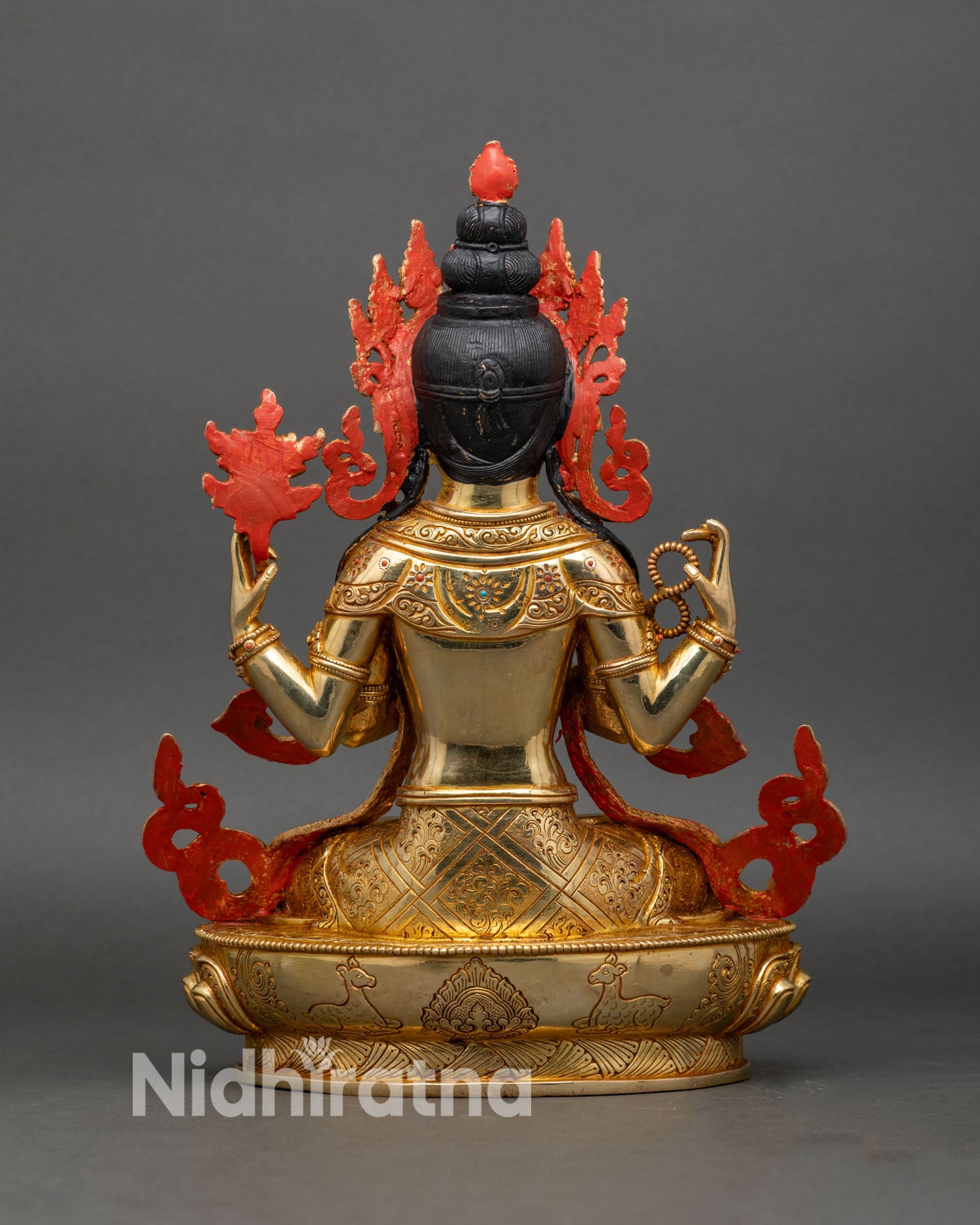 Back view of handcrafted copper Chenrezig adorned with gold gilding and jewelry details