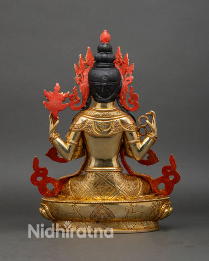 Back view of handcrafted copper Chenrezig adorned with gold gilding and jewelry details