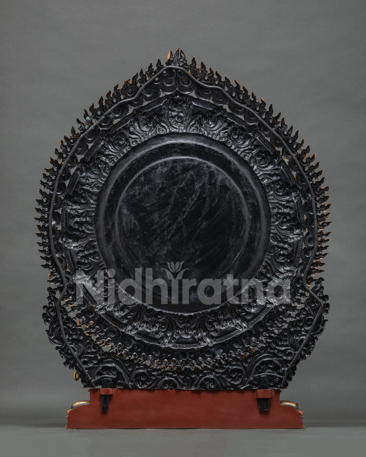 Back view of handcrafted copper Mahakala statue with ornate flaming halo, Nepal lost-wax casting