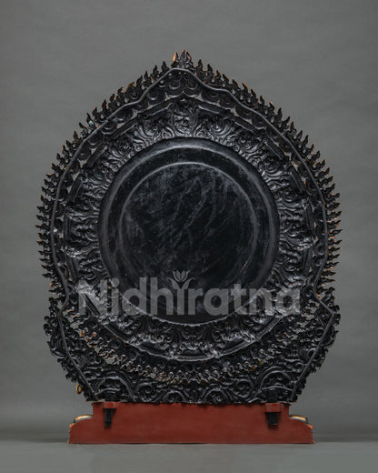 Back view of handcrafted copper Mahakala statue with ornate flaming halo, Nepal lost-wax casting