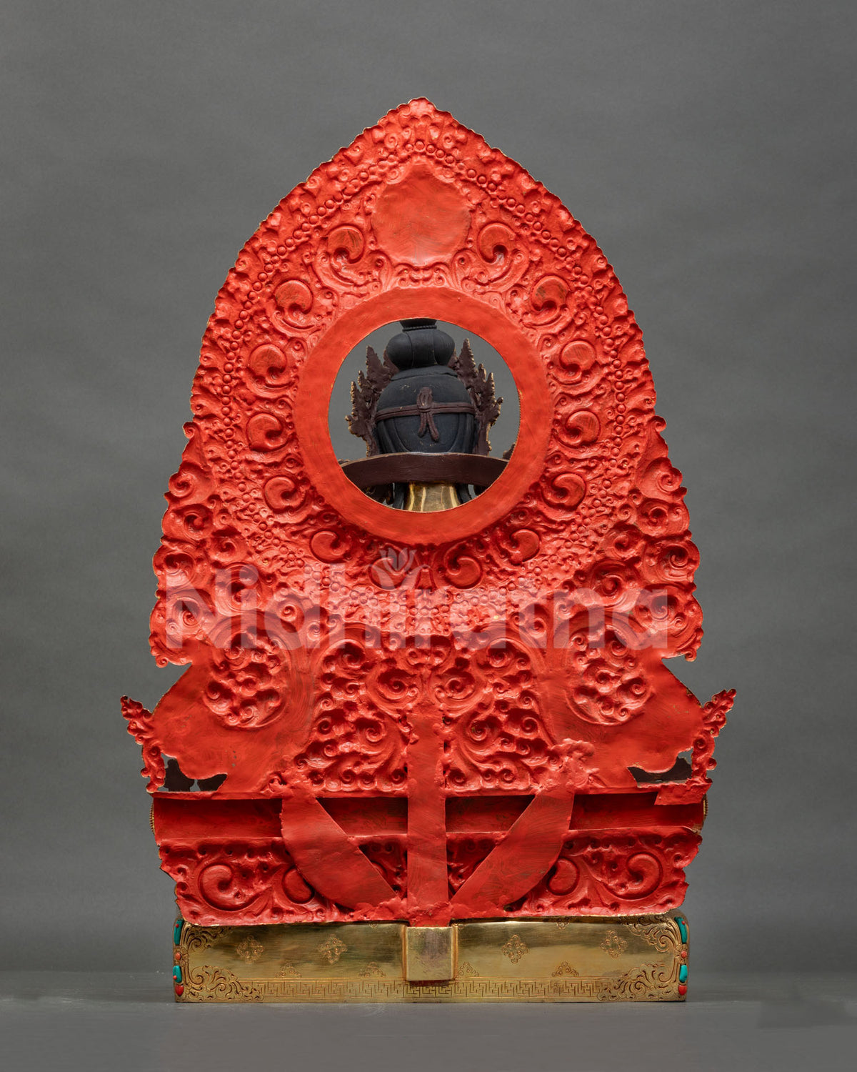 Back view of handcrafted copper Vajrasattva statue showing lost-wax casting and red painted halo