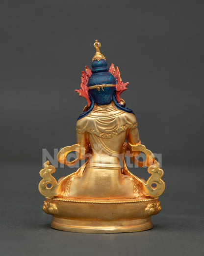 Back view of handcrafted copper Vajrasattva statue with intricate gold gilded details from Patan Nepal.