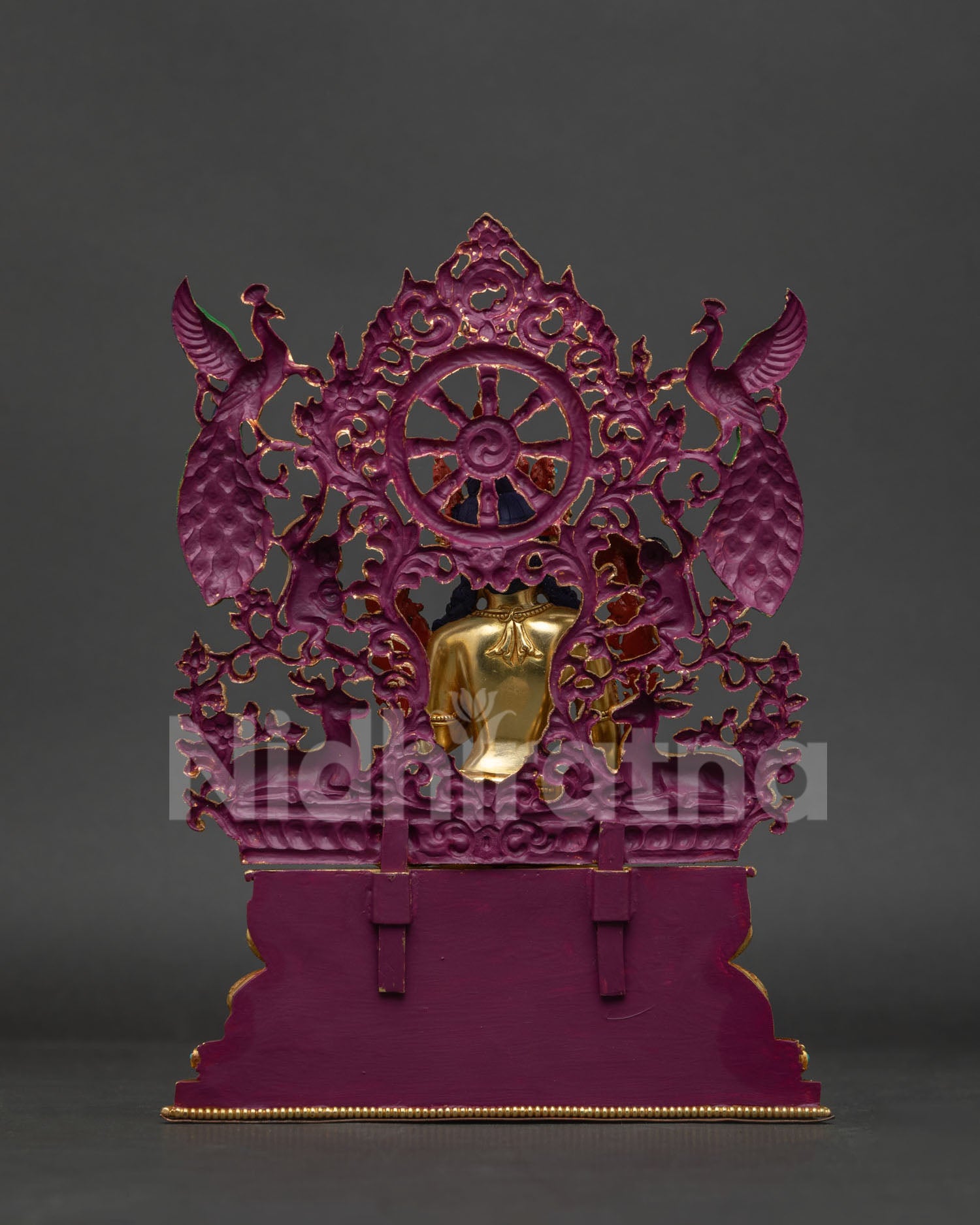 Back view of handcrafted Green Tara statue showing fire-gilded copper alloy craftsmanship