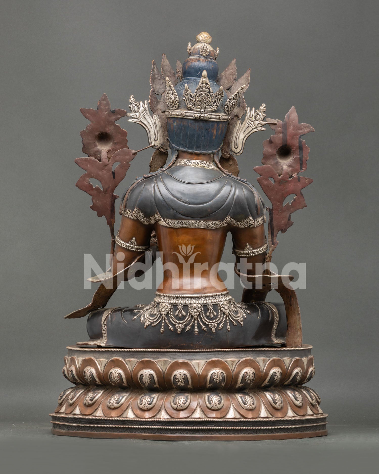 Back view of handcrafted Green Tara Statue with detailed robes and oxidized copper craftsmanship