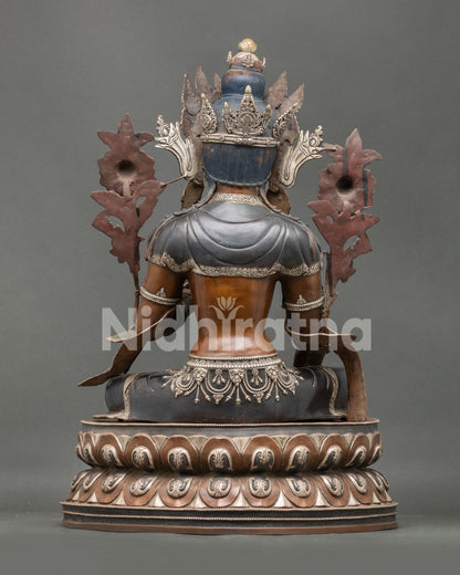 Back view of handcrafted Green Tara Statue with detailed robes and oxidized copper craftsmanship
