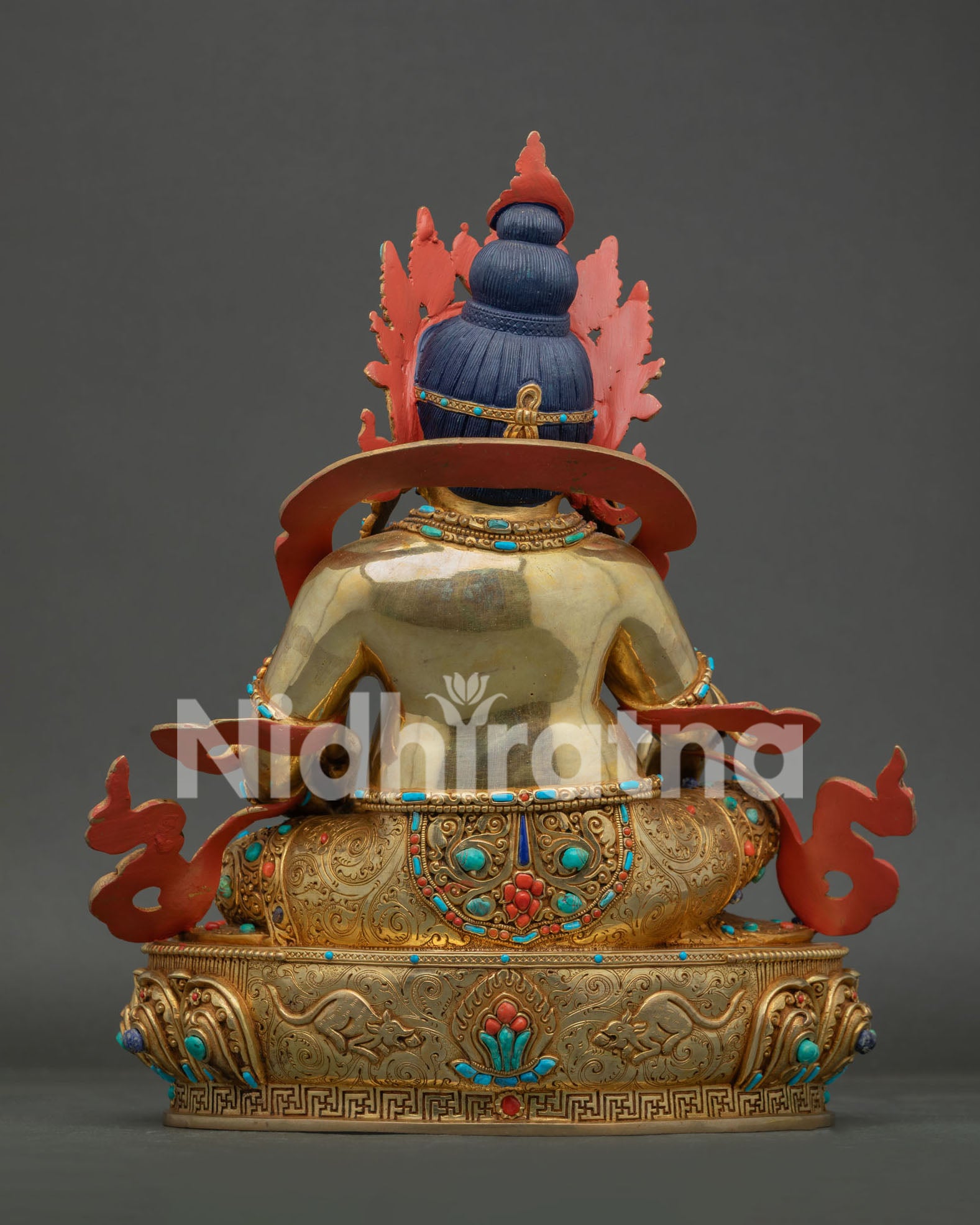 Back view of handcrafted Jambhala Statue showing detailed robes ornaments and traditional Nepalese craftsmanship