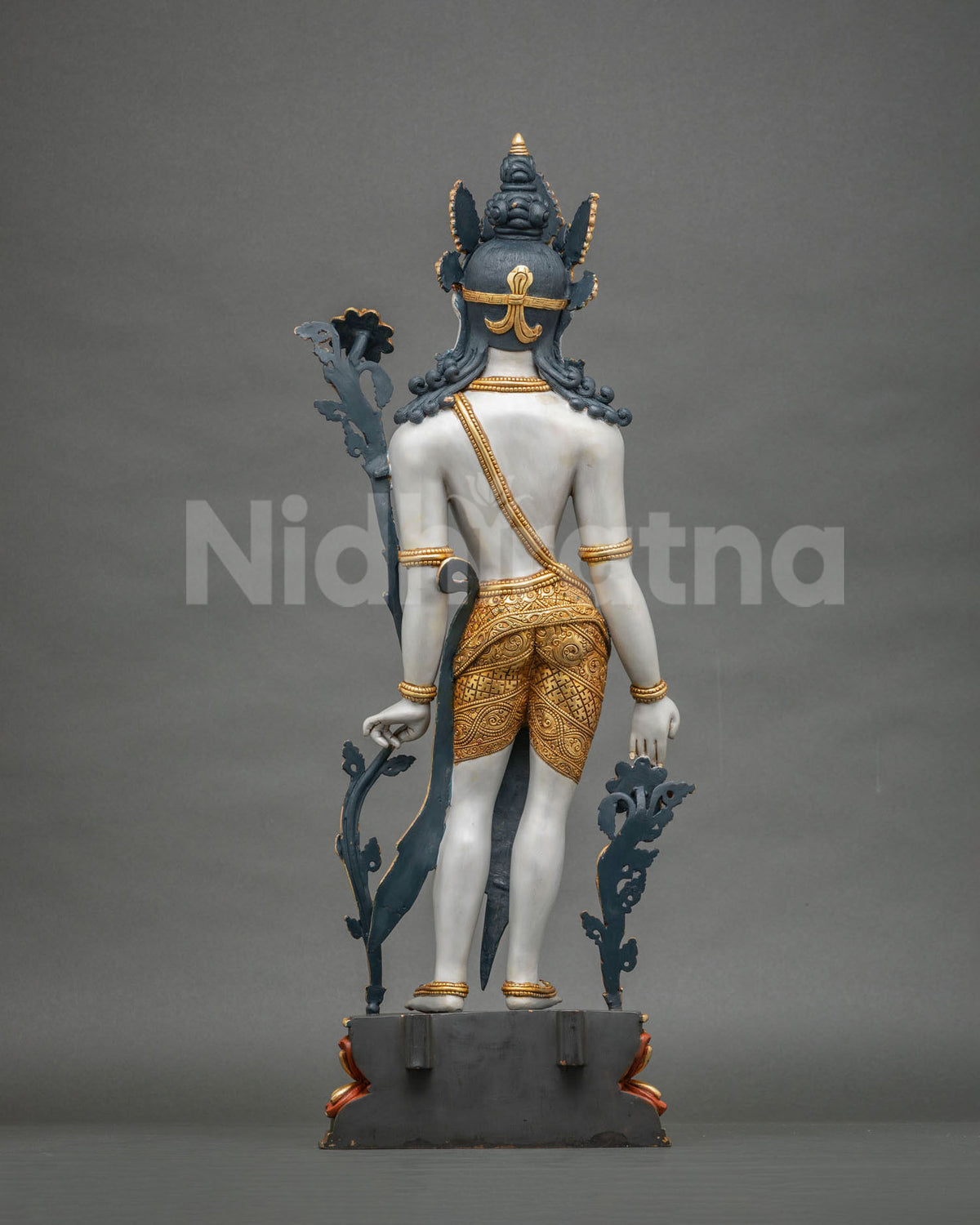 Back view of handcrafted Lokeshvara statue with gold gilded lower garment and detailed hair and crown
