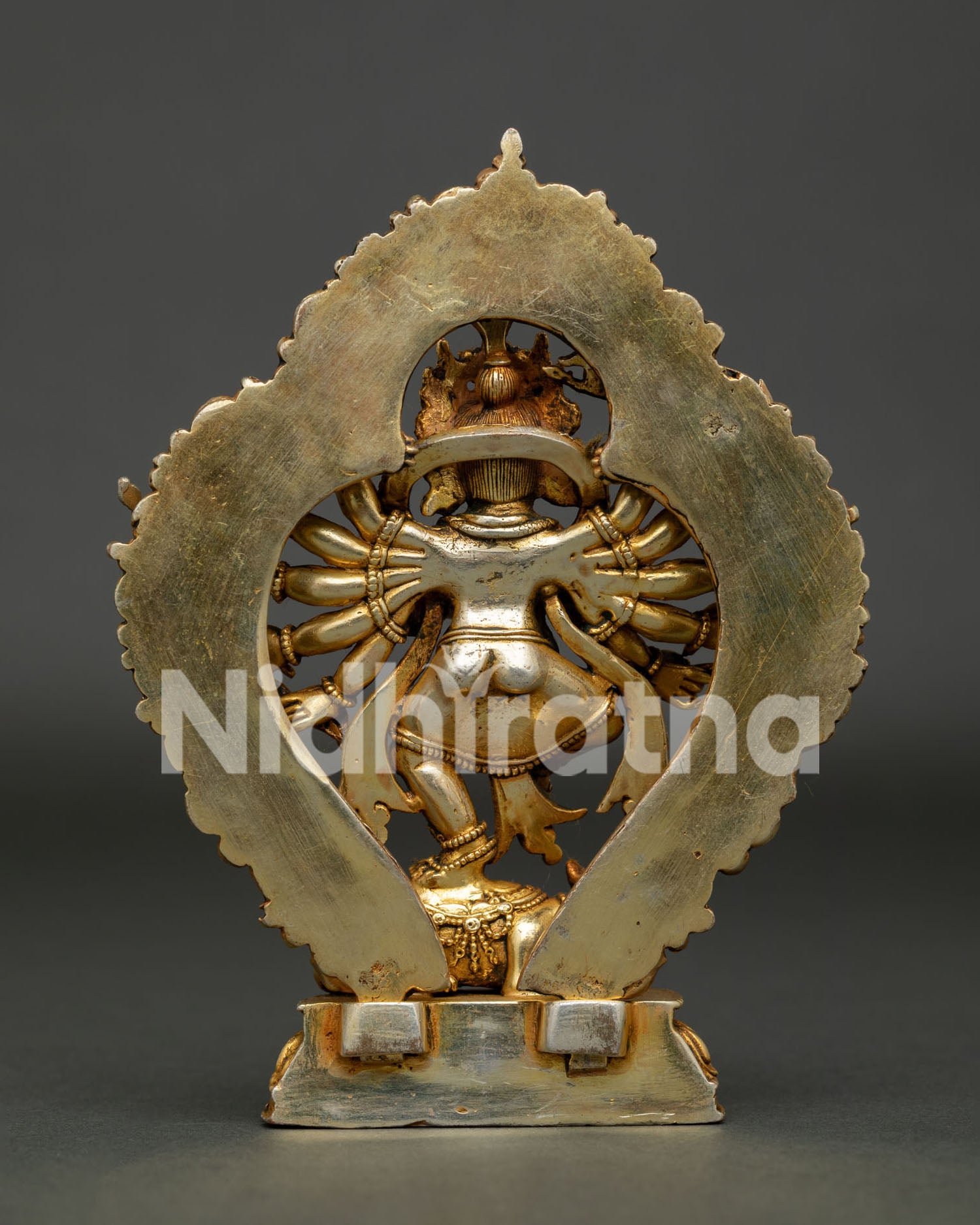 Back View of Handcrafted Lord Ganesh Statue with Ornate Halo Made in Nepal.