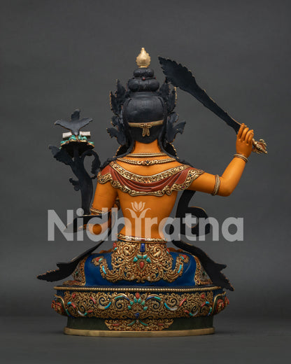 Back View of Handcrafted Manjushri Statue Displaying Intricate Repoussé Work and Gold Gilded Finish
