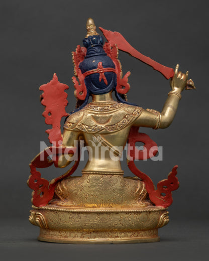 Back view of handcrafted Manjushri Statue showing lotus pedestal and copper finish