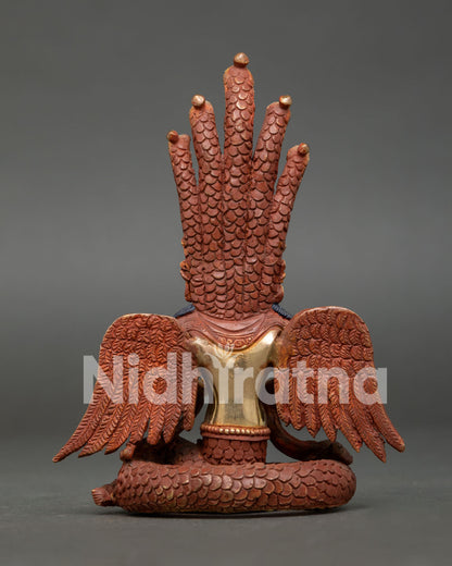 Back view of handcrafted Naga Kanya statue showing flowing robes, wings and copper craftsmanship.