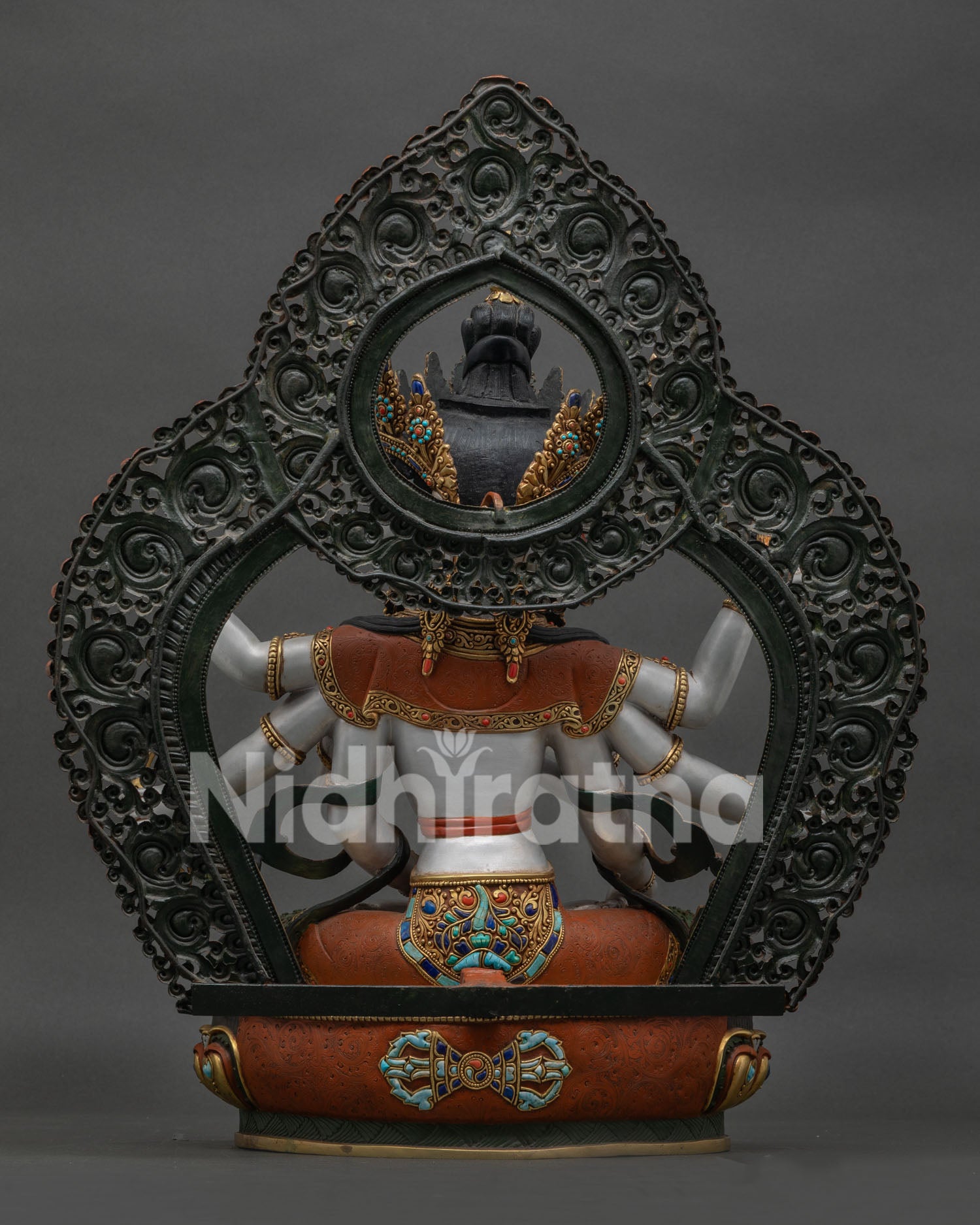 back view of handcrafted namgyalma statue featuring floral halo and detailed copper artistry