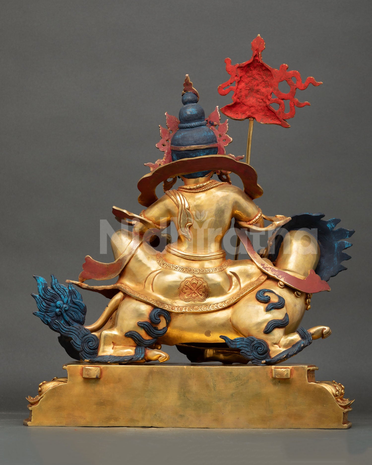 Back view of handcrafted Namtoshe statue with intricate Himalayan craftsmanship and copper details