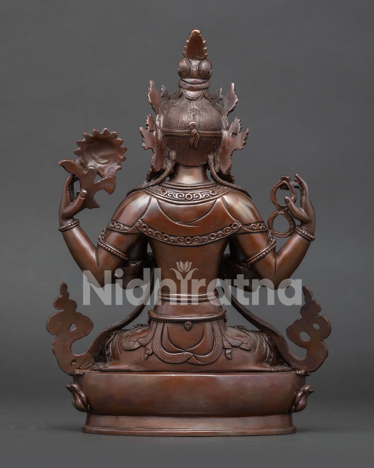 Back view of handcrafted Nepalese Chenrezig sculpture with intricate details