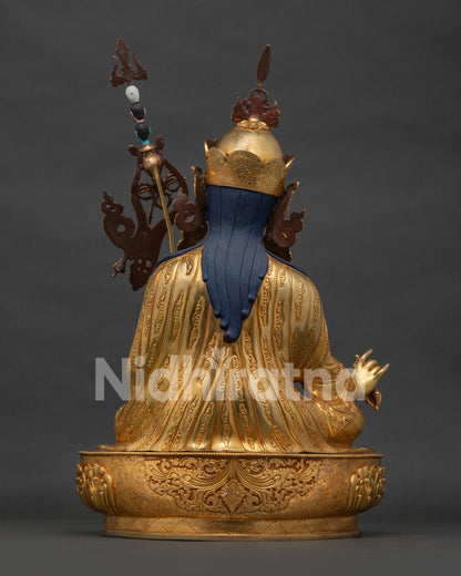 Back view of handcrafted Nepalese gold Padmasambhava statue showing detailed copper casting work.