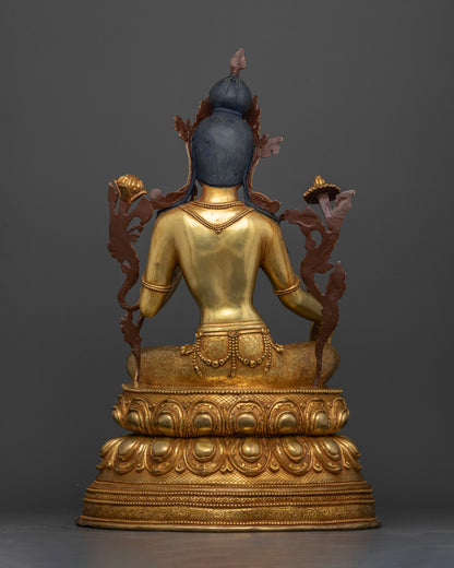 Back view of handcrafted Nepalese Green Tara statue with intricate carved details