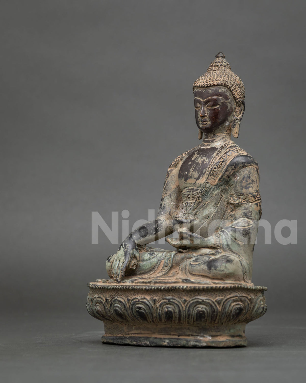 Back view of handcrafted Nepalese oxidized copper Shakyamuni Buddha statue
