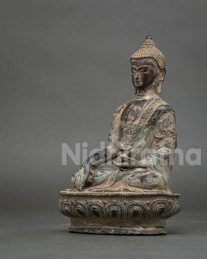 Back view of handcrafted Nepalese oxidized copper Shakyamuni Buddha statue