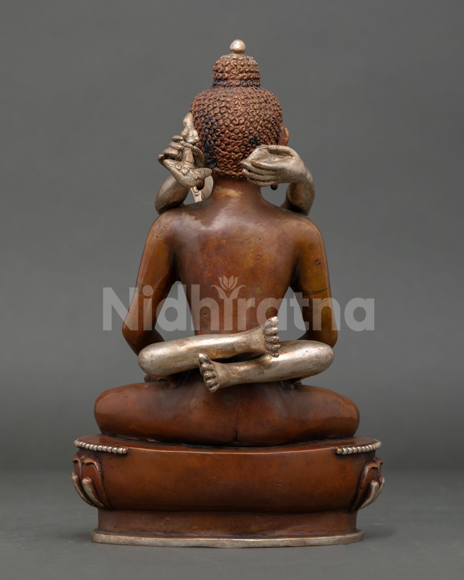 back view of handcrafted samantabhadra statue with engraved copper lotus base