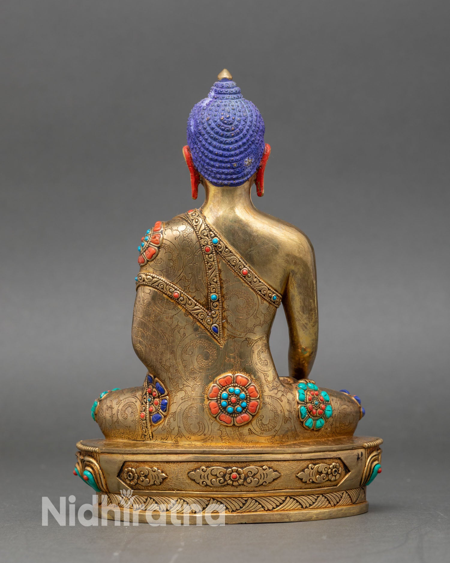 Back view of handcrafted Shakyamuni Buddha statue with gold gilding and detailed carvings