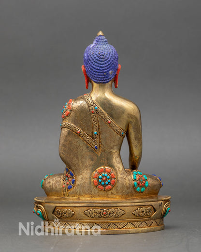Back view of handcrafted Shakyamuni Buddha statue with gold gilding and detailed carvings