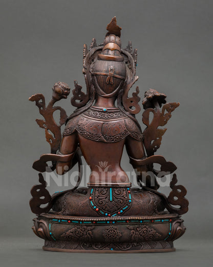 Back view of handcrafted White Tara statue from Patan Nepal showing oxidized copper detailing lotus pedestal craftsmanship and sacred Himalayan Buddhist devotional art