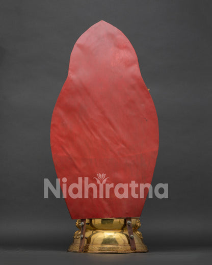Back view of handcrafted Yeshe Tsogyal statue on lotus base with detailed golden halo